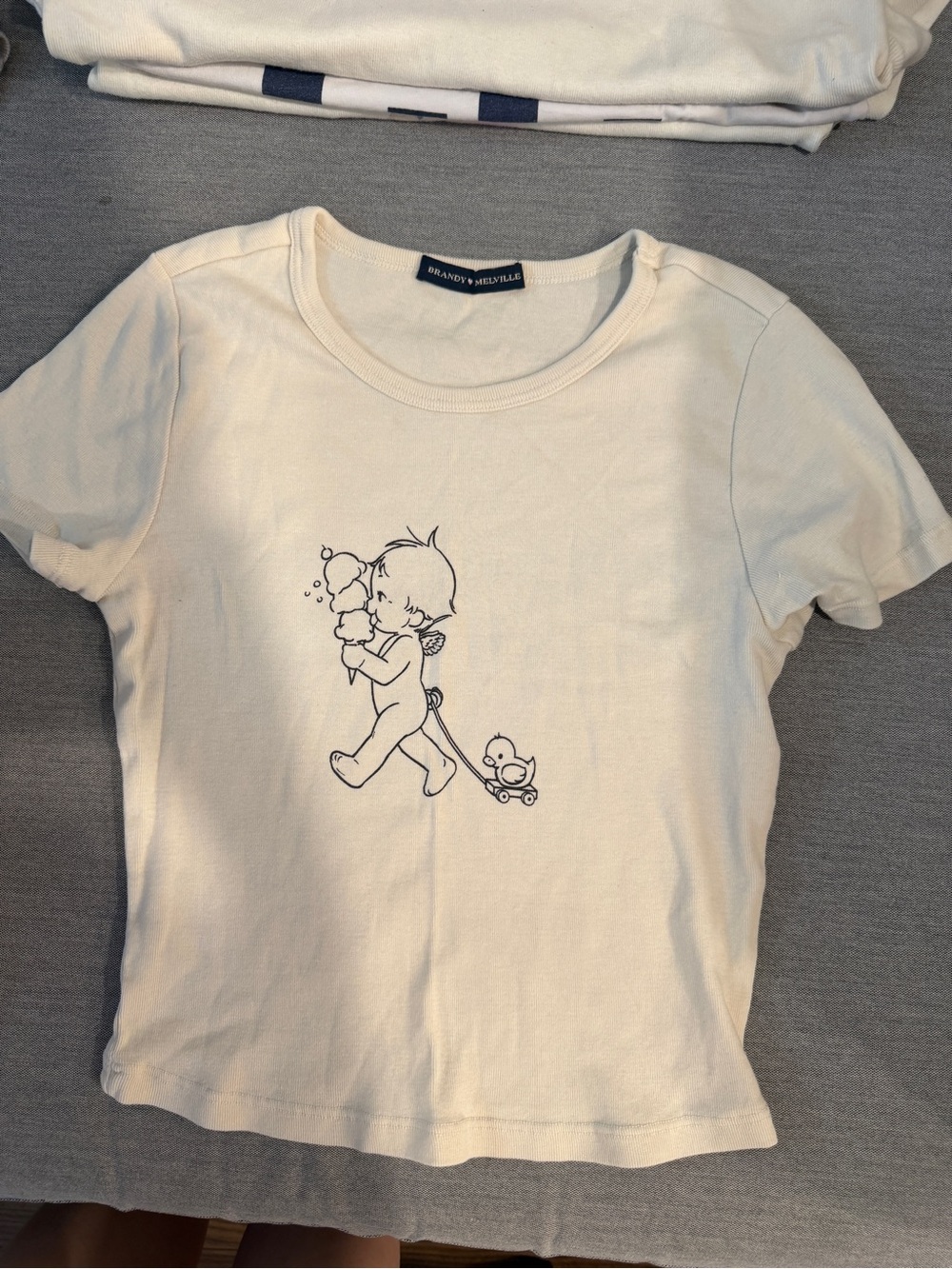 Brandy Melville Cream Tee with Navy Line Art Kid Graphic